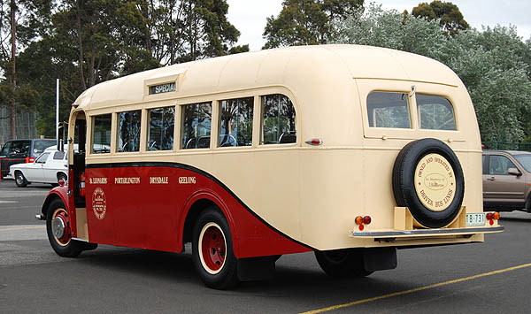 many old buses had the emergency exit doors on rounded backs